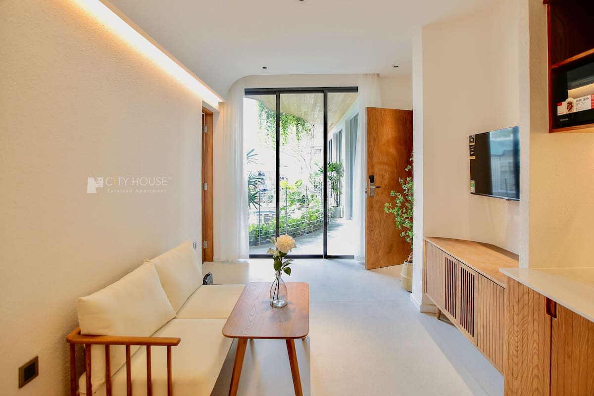 Family Twin Room | Living area | 40-inch Smart TV with cable channels, TV, Netflix