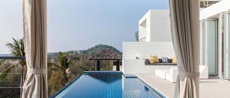 Outdoor pool, pool umbrellas, sun loungers