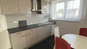 Fridge, stovetop, electric kettle, cookware/dishes/utensils