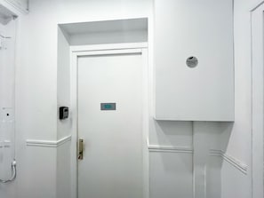 A white door with a number plate indicating room 106.
