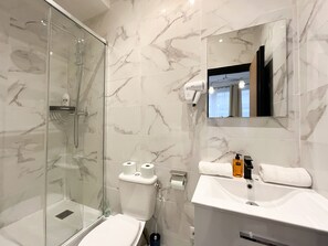 Shower, hair dryer, towels