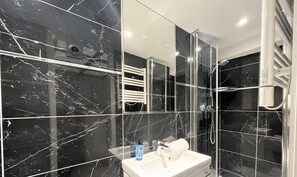 Shower, hair dryer, towels