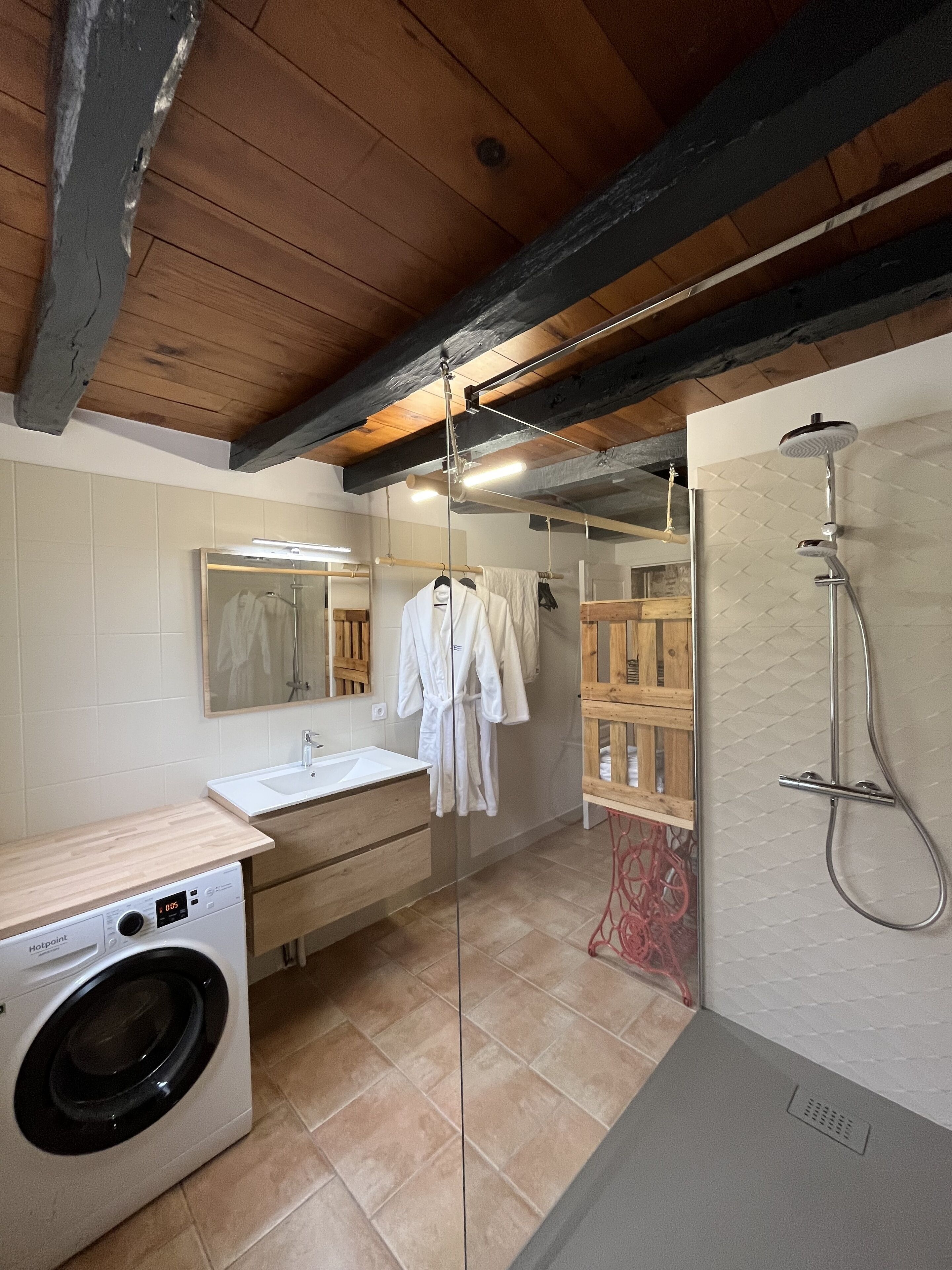Shower, hair dryer, towels, toilet paper