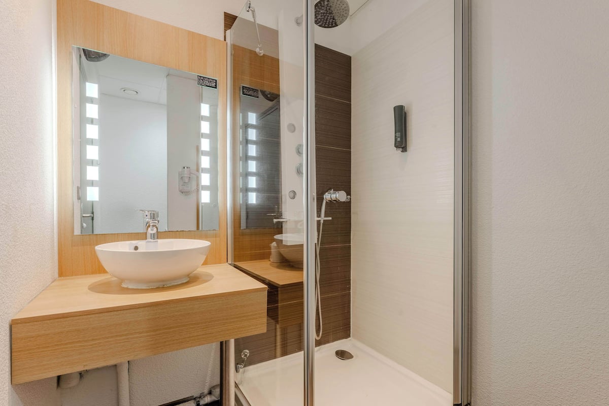 shower, towels, soap, toilet paper