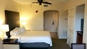 A hotel room with a bed, a desk, a chair, a table, and a ceiling fan. - Marriott Grande Vista Deluxe Studio Luxury Resort April 12-19 25 Sat Check-in (Orlando)
