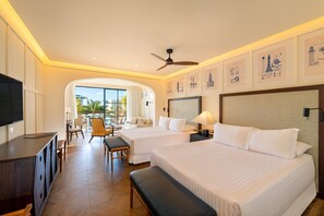 A hotel room with two beds, a TV, a desk, and a balcony with chairs. - Ocean El Faro - Privilege RoofTop Junior Suite Pool view (Punta Cana)