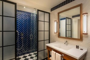 A modern bathroom with a shower, white sink, and a large mirror. - Ocean El Faro - Privilege RoofTop Junior Suite Pool view (Punta Cana)