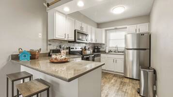 Coffee/tea maker, fridge, microwave, oven