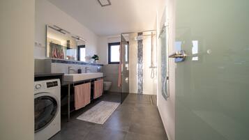 Shower, hair dryer, towels, soap