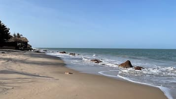 On the beach, sun-loungers, beach towels
