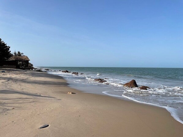 On the beach, sun loungers, beach towels