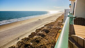A balcony with a view of a beach and ocean. - Stunning Top-Floor 3 Bedroom, 2 Bath Oceanfront Condo 902 Pinnacle (North Myrtle Beach)