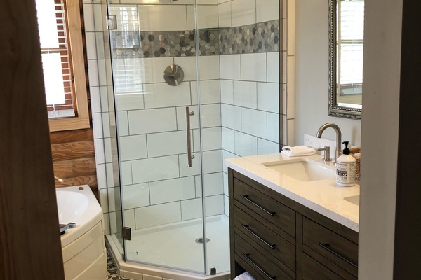 Combined shower/tub, hair dryer, towels, toilet paper