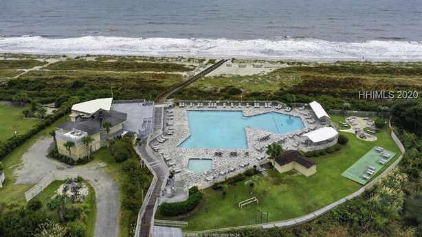 An aerial view of a coastal property with a swimming pool, a tennis court, and a beach access path. - Only 200 Steps to the Huge Oceanfront Pool (Hilton Head Island)