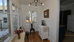 A kitchen with white cabinets, a coffee maker, and a sign that says "Fresh Coffee." - Vintage Gem in the Heart of Sheridan (Sheridan)