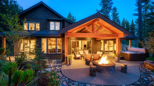 A modern house with a large patio, outdoor seating, and a fire pit. - Beautiful Suncadia House With Two Master Bedrooms and plenty of space for kids!  (Cle Elum)