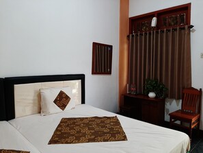 Deluxe Double or Twin Room, 1 Double or 2 Twin Beds, Non Smoking (AC) | Desk, bed sheets - Hotel Dana Jogja (Yogyakarta)