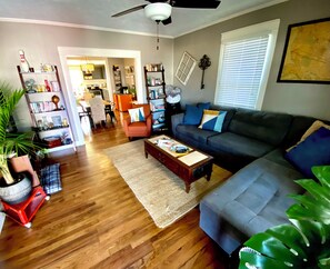 Relax in this inviting living space with a sofa, coffee table, and comfortable chair.