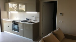 A modern kitchen with a dishwasher, oven, and a built-in sink. - Very beautiful modern 2-Bed Apartment in Javea (Javea)