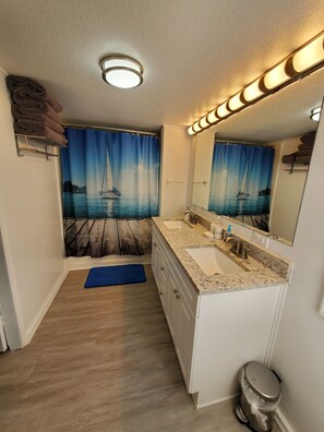 Combined shower/bathtub, hair dryer, towels, soap