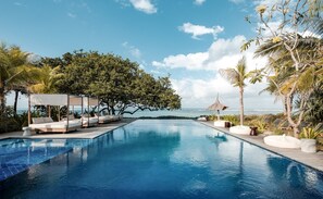 Outdoor pool, open 9:00 AM to 10:00 PM, pool umbrellas, pool loungers