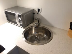 Studio, Multiple Beds, Balcony (incl. EUR 25 cleaning fee per stay) | Private kitchenette | Fridge, microwave, oven, stovetop - Apartment Westside (Regensburg)