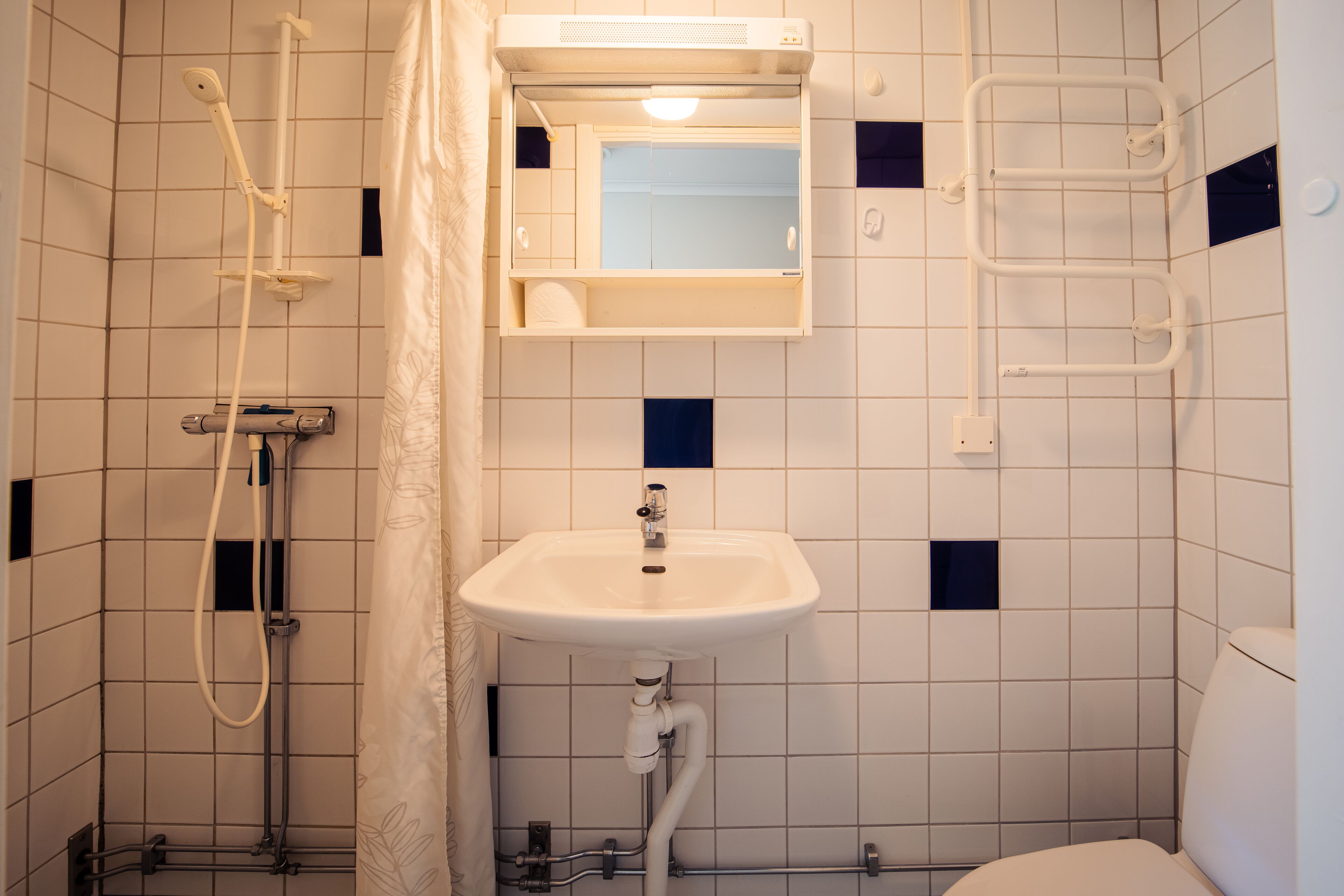 studio | bathroom | shower, towels, soap, toilet paper