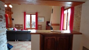 A kitchen with a wooden countertop, a built-in sink, and a tiled floor. - Charming Cottage with Private Pool, Sauna, and Garden in Saint-Juire-Champgillon (Saint-Juire-Champgillon)