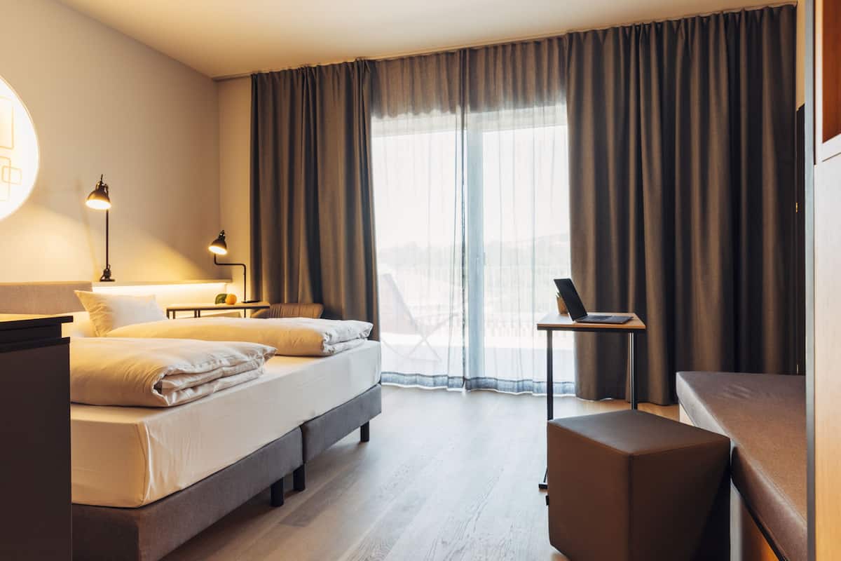 Studio | 2 bedrooms, hypo-allergenic bedding, in-room safe, desk
