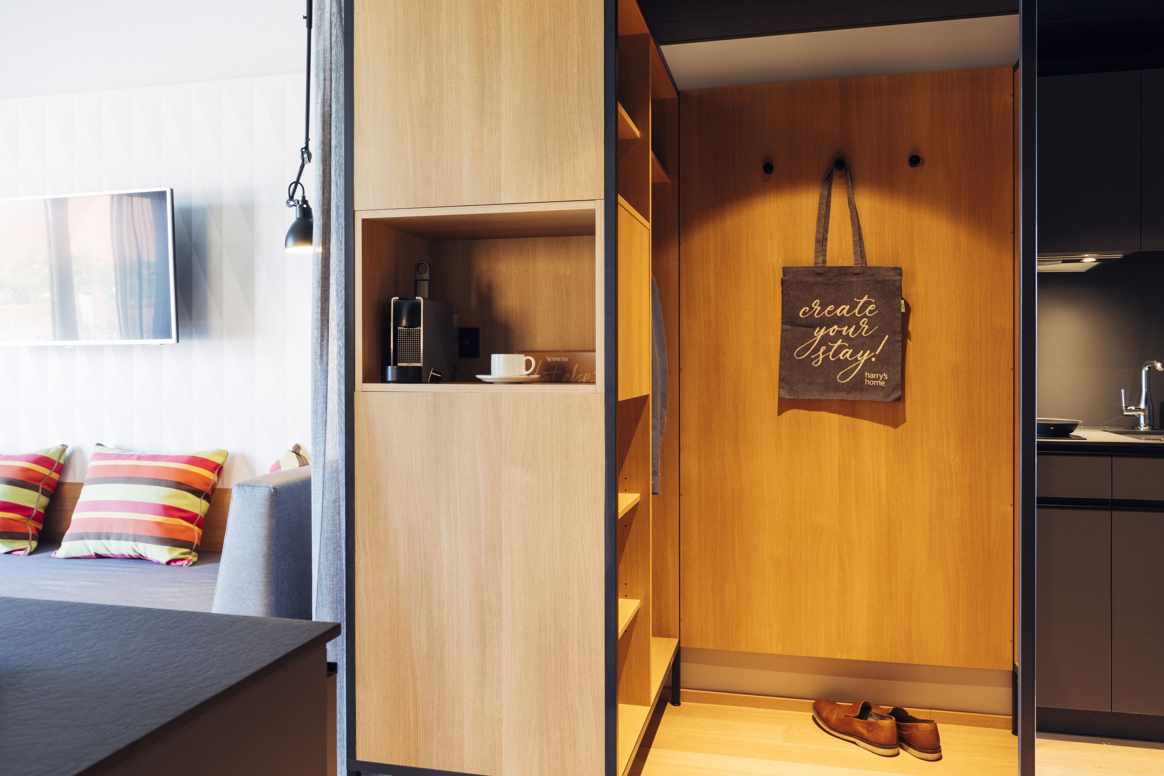 A modern room with a wooden cabinet, a coffee table, and a wall-mounted sign.