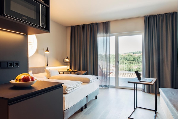 Hypo-allergenic bedding, in-room safe, desk, blackout curtains