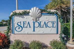 Welcome to Sea Place, where a beautiful seashell motif greets you above a natural setting.