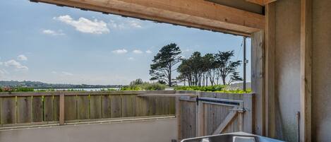 A hot tub with a view of the countryside.