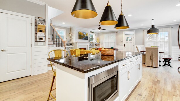 A modern kitchen with a central island, stainless steel appliances, and pendant lighting. - Incline Heights Haven - St Elmo District,  Chattanooga (Chattanooga)