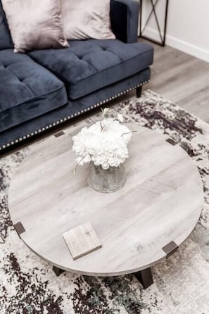 Relax in a stylish space with a minimalist coffee table and comfortable sofa.