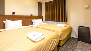 A hotel room with two beds, a headboard, a window with curtains, a desk, and a trash bin. - HOTEL LiVEMAX OKAZAKI (Okazaki)
