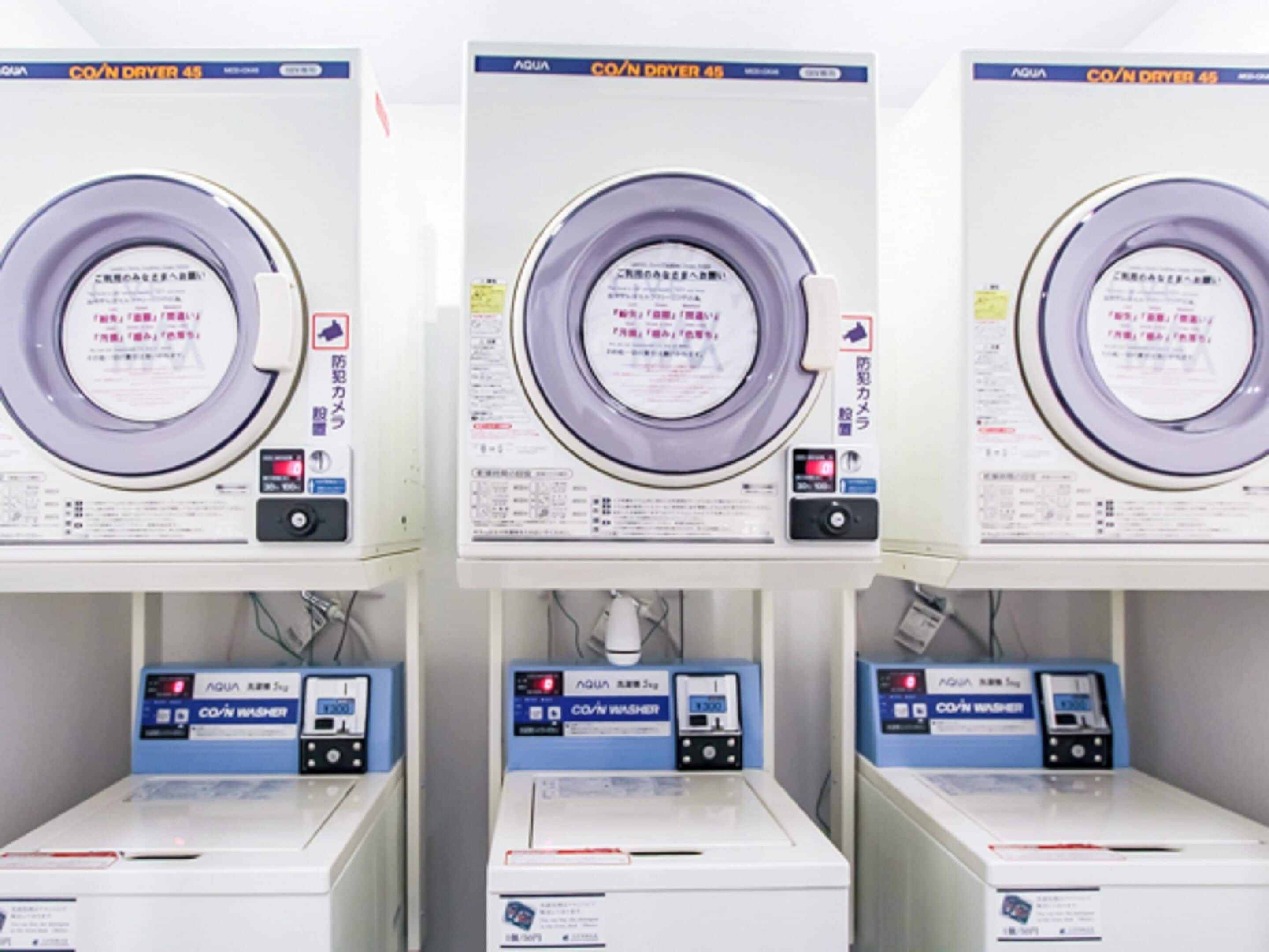 Three rows of identical machines with labels in a foreign language, likely indicating a specialized facility or equipment.