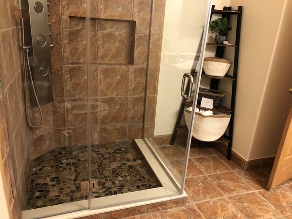 Shower, hair dryer, towels, soap