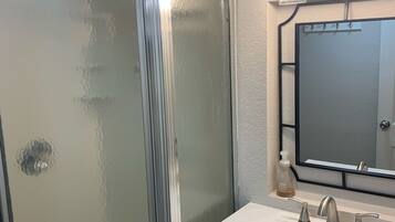 Shower, hair dryer, towels, soap