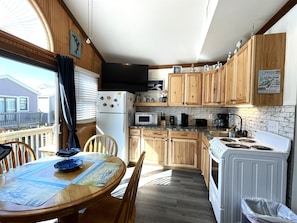 Fridge, microwave, stovetop, cookware/dishes/utensils