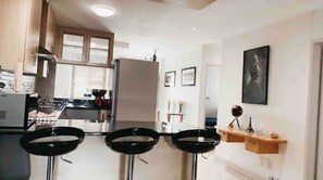 Fridge, microwave, dining tables