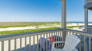 A balcony with a view of the beach and ocean. - Beachside Condo | Pet-Friendly, Balcony Views & Coastal Charm (Corpus Christi)