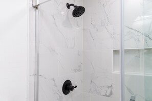 Shower, hair dryer, towels, shampoo