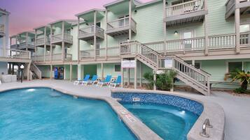 A heated pool, sun loungers