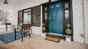 A front porch with a blue door, numbered 1362, and two potted plants. - 6 bedroom Large house in Pickwick district Springfield Near MSU (Springfield)