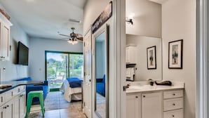 A modern bathroom with a large mirror, white cabinets, and a sink. - Bikes and beach chairs included!30A-Studio between Rosemary and Alys Beach (Seacrest Beach)