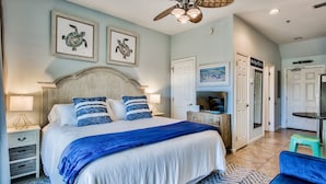 A bedroom with a large bed, a ceiling fan, and artwork on the walls. - Bikes and beach chairs included!30A-Studio between Rosemary and Alys Beach (Seacrest Beach)