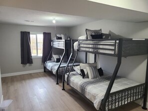 A bunk bed room with a window, curtains, and a ceiling light. - Bayview Condos #3, Ogallala Beach! Great Location! (Ogallala)
