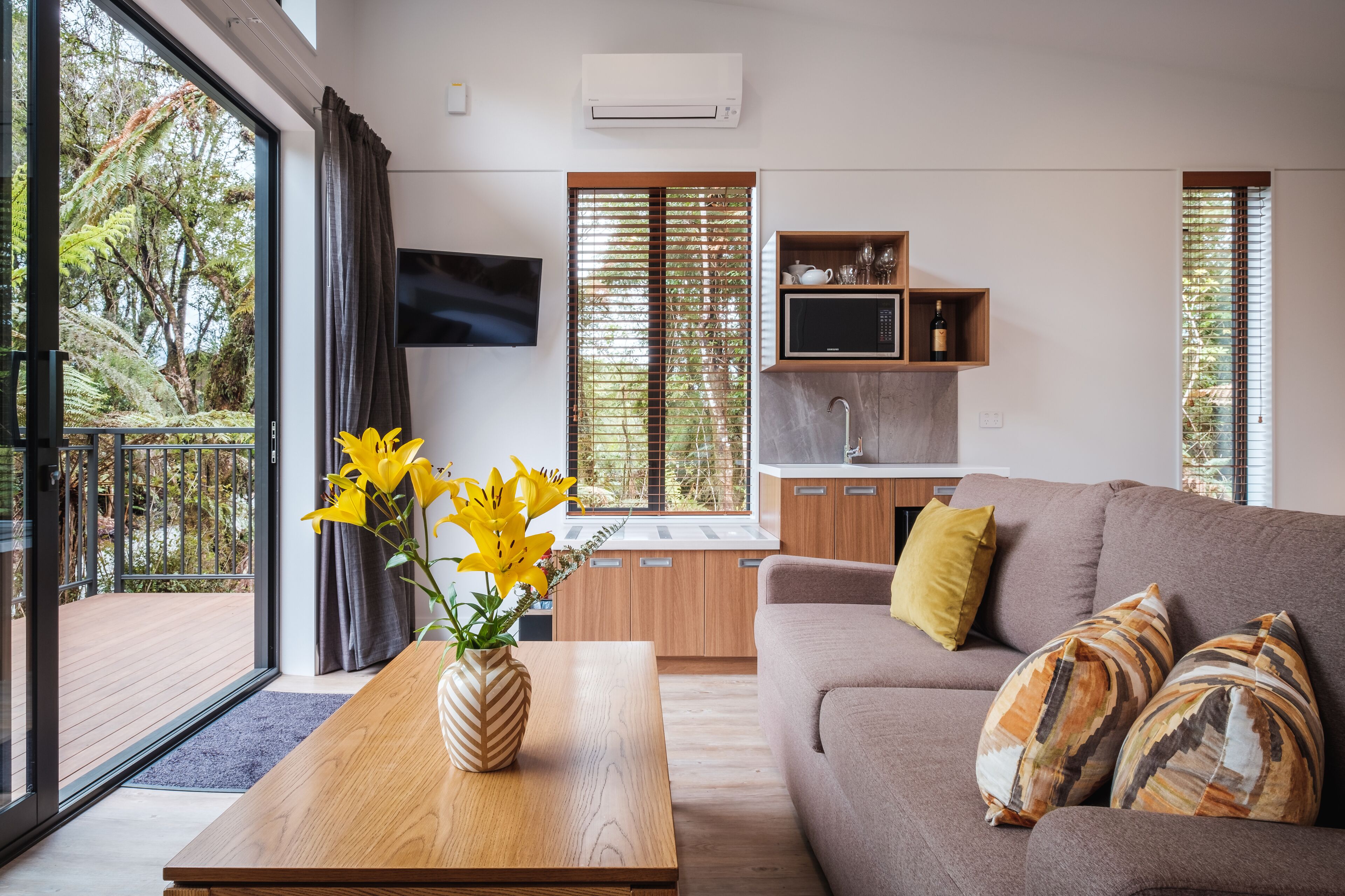 Deluxe Tree Lodge | Living area | LCD TV, heated floors