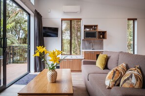 Deluxe Tree Lodge | Living area | LCD TV, heated floors - Rainforest Deluxe (Franz Josef Glacier)